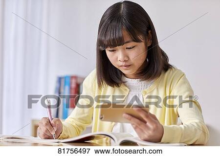 Japanese kid studying at home View Large Photo Image Stock Photo - Japanese kid studying at home. Fotosearch