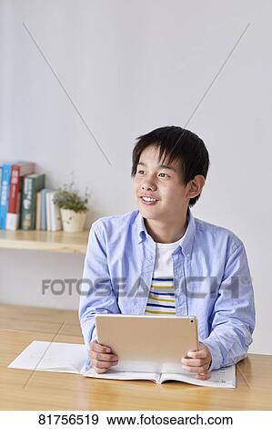 Japanese kid studying at home View Large Photo Image Stock Photo - Japanese kid studying at home. Fotosearch