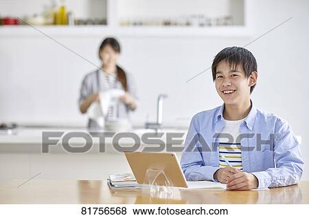 Japanese kid studying at home View Large Photo Image Stock Photo - Japanese kid studying at home. Fotosearch