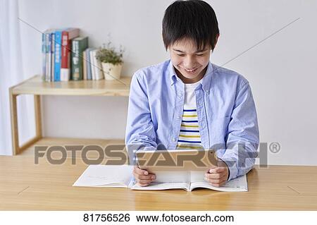 Japanese kid studying at home View Large Photo Image Stock Photograph - Japanese kid studying at home. Fotosearch