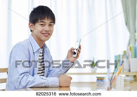 Japanese kid studying at home View Large Photo Image Stock Photograph - Japanese kid studying at home. Fotosearch