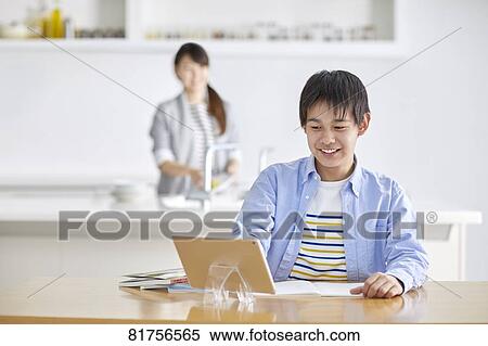 Japanese kid studying at home View Large Photo Image Stock Photography - Japanese kid studying at home. Fotosearch