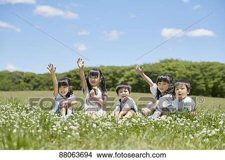 Picture - Japanese kids in a city park. Fotosearch