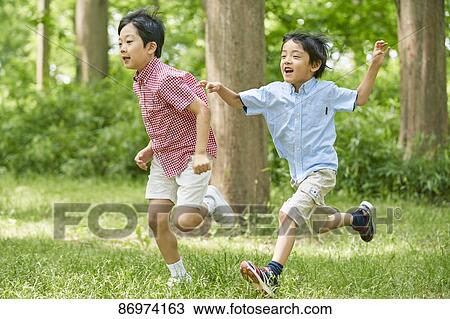 Japanese kids in a city park View Large Photo Image Stock Image - Japanese kids in a city park. Fotosearch