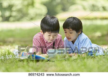 Japanese kids in a city park View Large Photo Image Stock Image - Japanese kids in a city park. Fotosearch