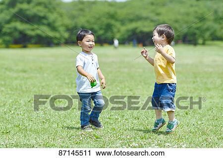Japanese kids in a city park View Large Photo Image Stock Image - Japanese kids in a city park. Fotosearch