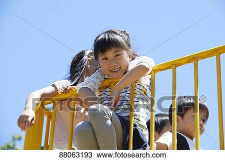 Japanese kids in a city park View Large Photo Image Stock Image - Japanese kids in a city park. Fotosearch