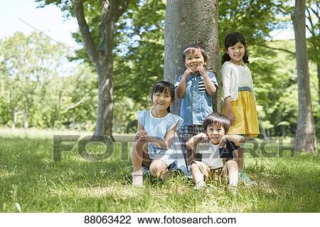 Japanese kids in a city park View Large Photo Image Stock Image - Japanese kids in a city park. Fotosearch