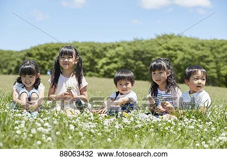 Japanese kids in a city park View Large Photo Image Stock Image - Japanese kids in a city park. Fotosearch