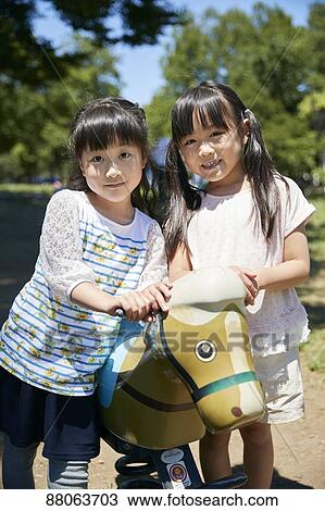Japanese kids in a city park View Large Photo Image Stock Image - Japanese kids in a city park. Fotosearch