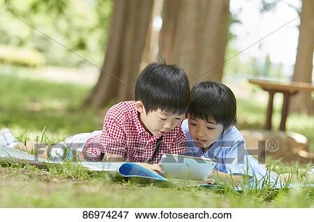 Japanese kids in a city park View Large Photo Image Stock Photo - Japanese kids in a city park. Fotosearch