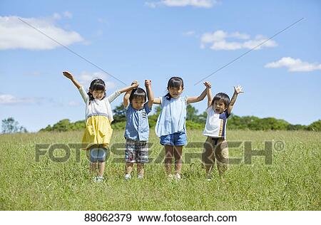 Stock Photo - Japanese kids in a city park. Fotosearch