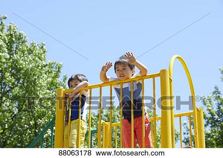 Japanese kids in a city park View Large Photo Image Stock Photo - Japanese kids in a city park. Fotosearch