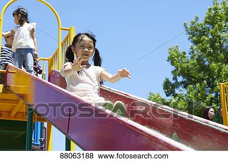 Stock Photo - Japanese kids in a city park. Fotosearch