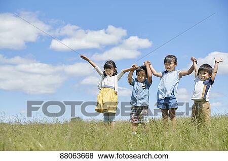 Stock Photo - Japanese kids in a city park. Fotosearch