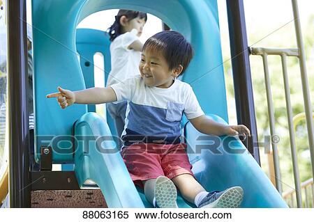 Stock Photography - Japanese kids in a city park. Fotosearch