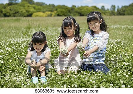 Japanese kids in a city park View Large Photo Image Stock Photography - Japanese kids in a city park. Fotosearch