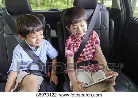 Japanese kids in the car View Large Photo Image Stock Image - Japanese kids in the car. Fotosearch