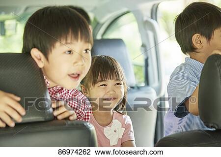 Japanese kids in the car View Large Photo Image Stock Image - Japanese kids in the car. Fotosearch