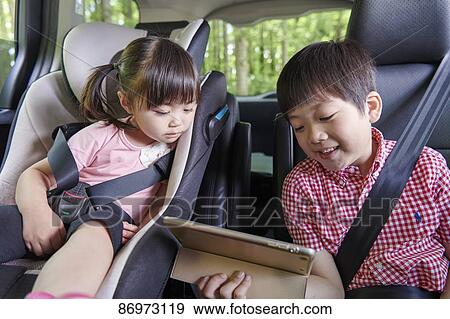 Japanese kids in the car View Large Photo Image Stock Photo - Japanese kids in the car. Fotosearch