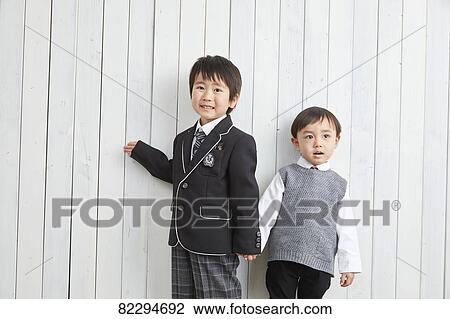 Stock Image - Japanese kids studio photo shoot. Fotosearch