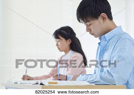 Picture - Japanese kids studying. Fotosearch