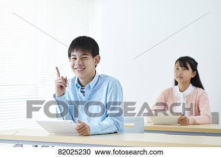 Stock Image - Japanese kids studying. Fotosearch