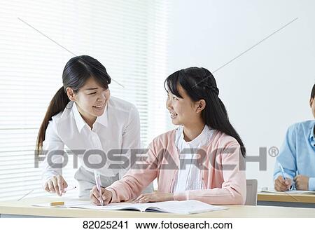 Stock Image - Japanese kids studying. Fotosearch