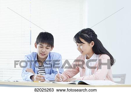 Stock Image - Japanese kids studying. Fotosearch