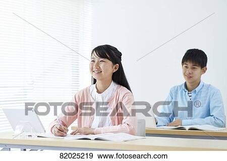 Stock Photo - Japanese kids studying. Fotosearch