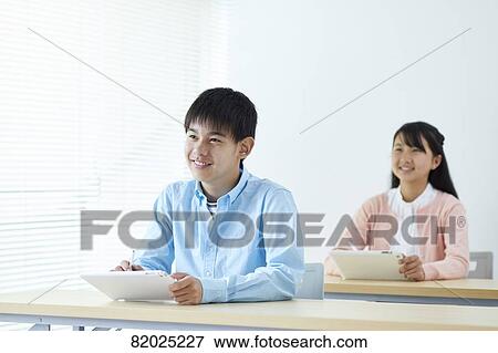 Stock Photo - Japanese kids studying. Fotosearch