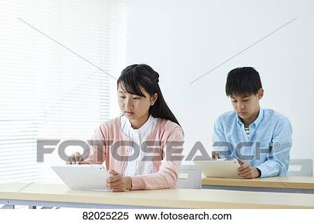 Stock Photography - Japanese kids studying. Fotosearch