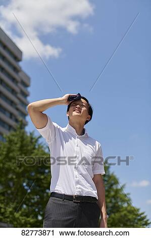 Stock Image - Japanese man in the hot weather. Fotosearch