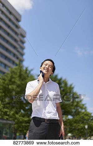 Stock Photo - Japanese man in the hot weather. Fotosearch