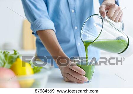 Japanese man making smoothie in the kitchen View Large Photo Image Stock Photo - Japanese man making smoothie in the kitchen. Fotosearch