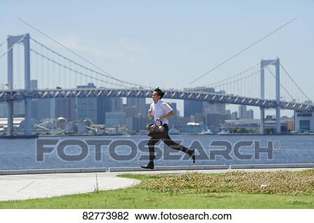 Japanese man running downtown Tokyo View Large Photo Image Stock Image - Japanese man running downtown Tokyo. Fotosearch