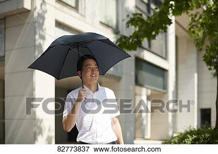 Japanese man with parasol View Large Photo Image Stock Photo - Japanese man with parasol. Fotosearch