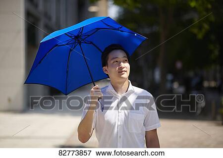 Japanese man with parasol View Large Photo Image Stock Photo - Japanese man with parasol. Fotosearch