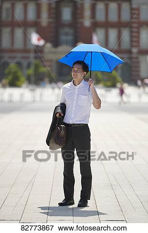 Stock Photo - Japanese man with parasol. Fotosearch