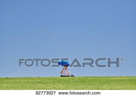 Japanese man with parasol View Large Photo Image Stock Photo - Japanese man with parasol. Fotosearch