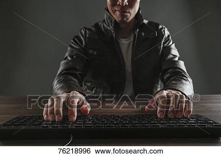 Stock Photograph - Japanese man working with keyboard. Fotosearch