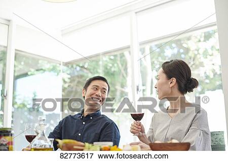 Japanese mature couple eating View Large Photo Image Stock Photo - Japanese mature couple eating. Fotosearch