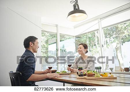 Japanese mature couple eating View Large Photo Image Stock Photograph - Japanese mature couple eating. Fotosearch