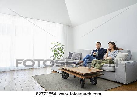 Picture - Japanese mature couple on the sofa. Fotosearch