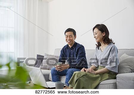 Japanese mature couple on the sofa View Large Photo Image Stock Photography - Japanese mature couple on the sofa. Fotosearch