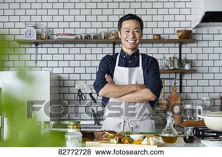 Japanese mature man in the kitchen View Large Photo Image Stock Photo - Japanese mature man in the kitchen. Fotosearch