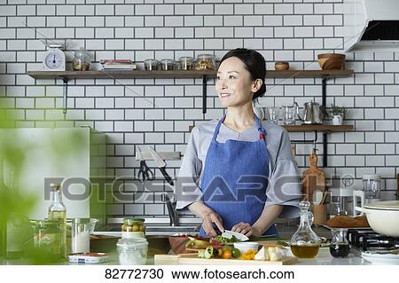 Japanese Mature Woman In The Kitchen Stock Image Fotosearch
