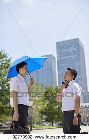 Japanese men with parasol View Large Photo Image Stock Image - Japanese men with parasol. Fotosearch