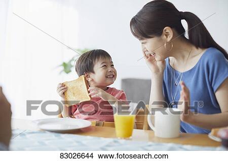 Japanese mother and kid having breakfast View Large Photo Image Picture - Japanese mother and kid having breakfast. Fotosearch