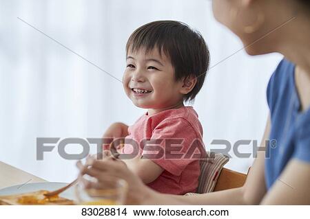 Japanese mother and kid having breakfast View Large Photo Image Picture - Japanese mother and kid having breakfast. Fotosearch